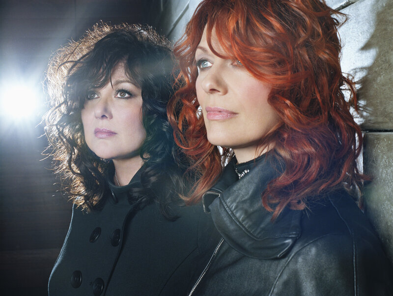 Two women with curly hair