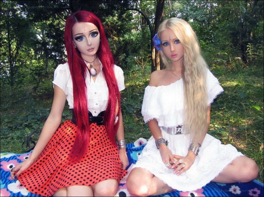 Two women with doll-like features