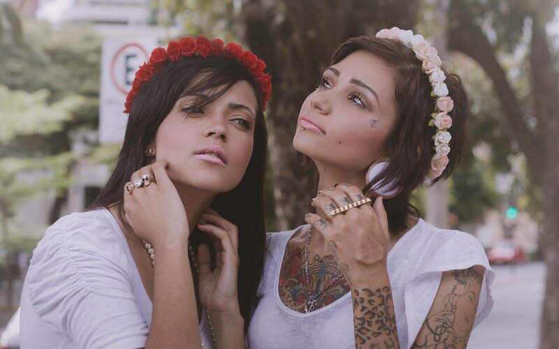two women with flower crowns