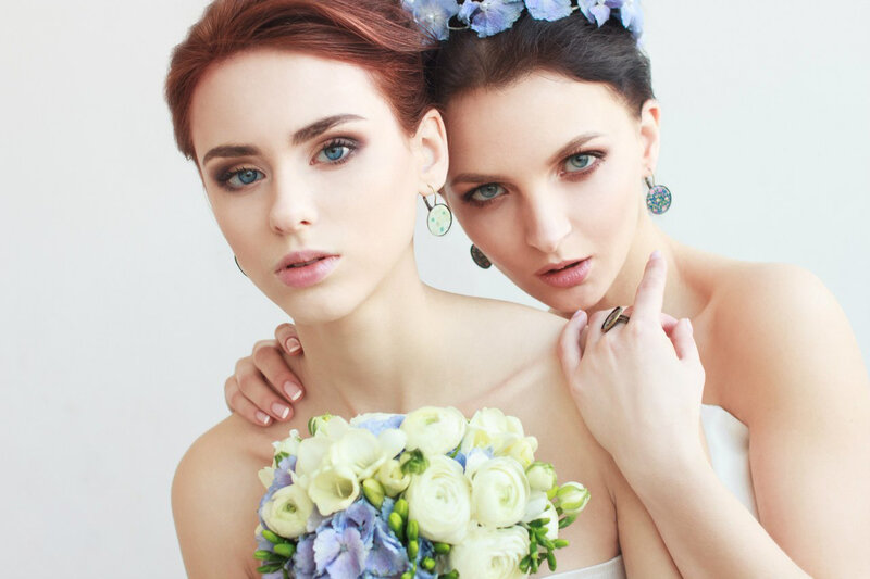 Two Women with Flowers — White, Serene
