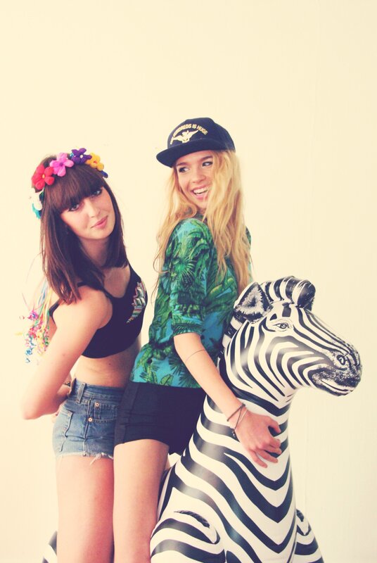 Two women with inflatable zebra
