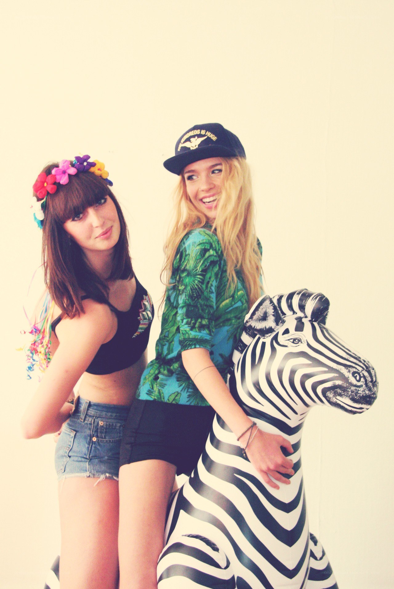 Two women with inflatable zebra