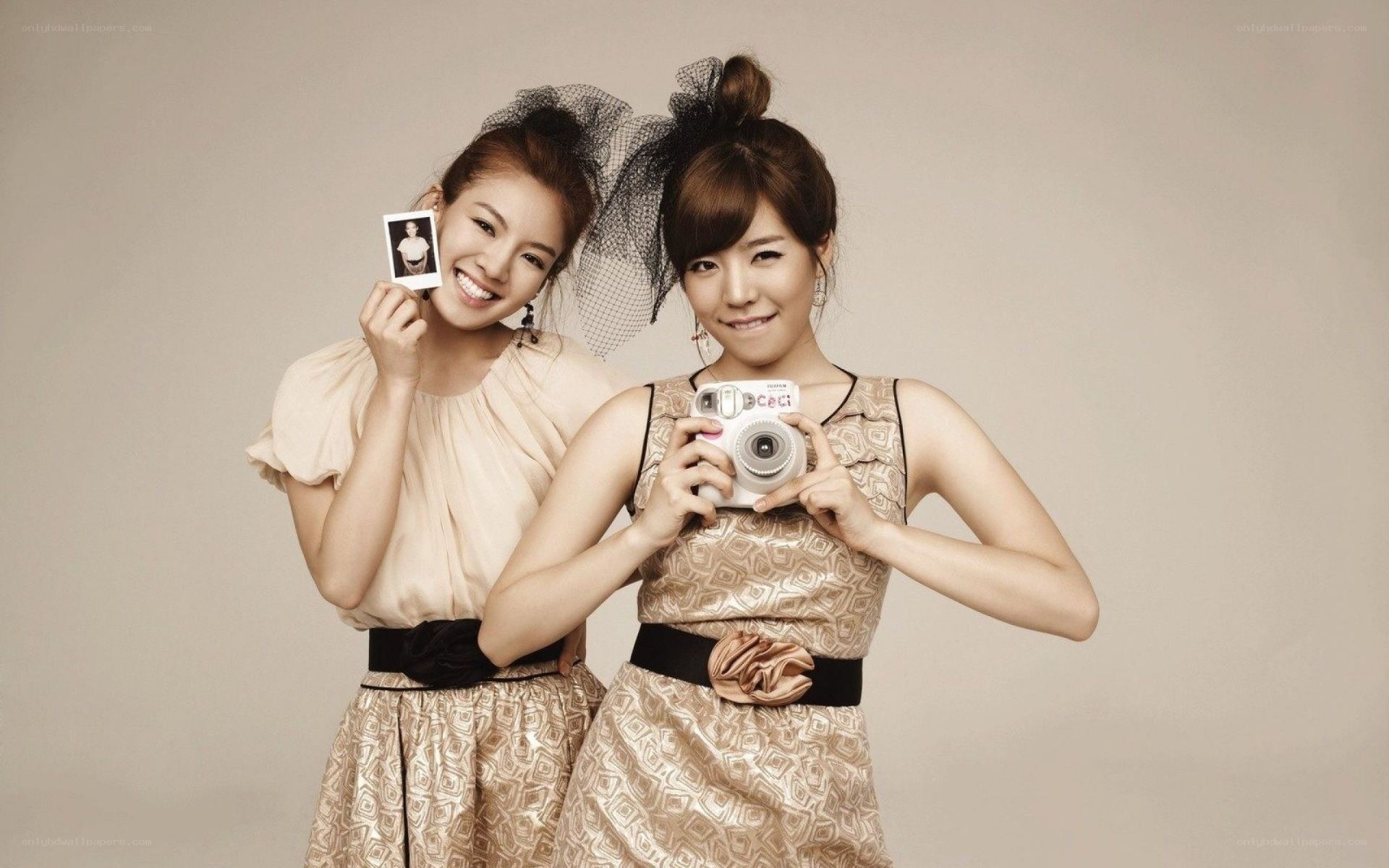 two women with instant camera
