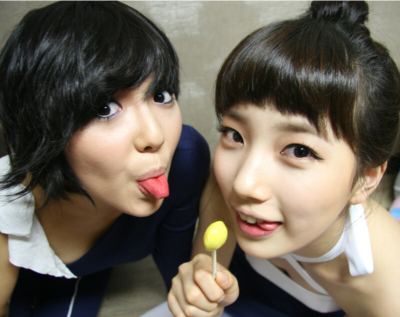 Two women with lollipops