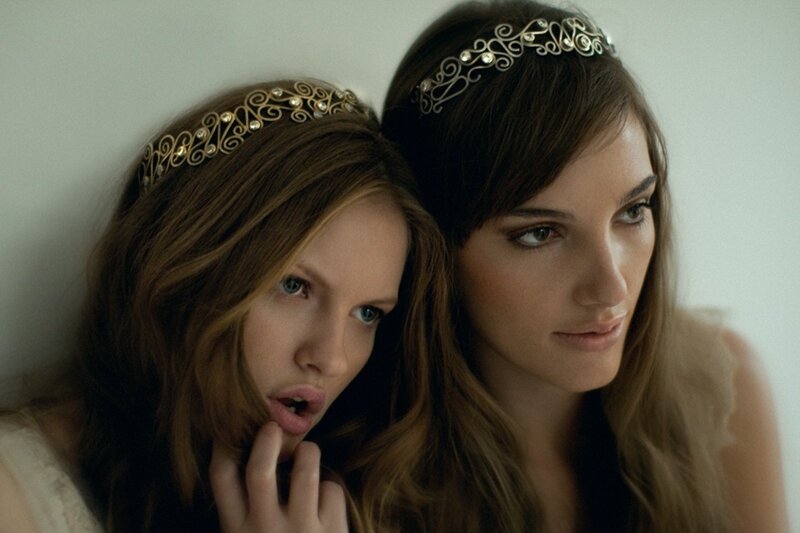 Two women with ornate headbands