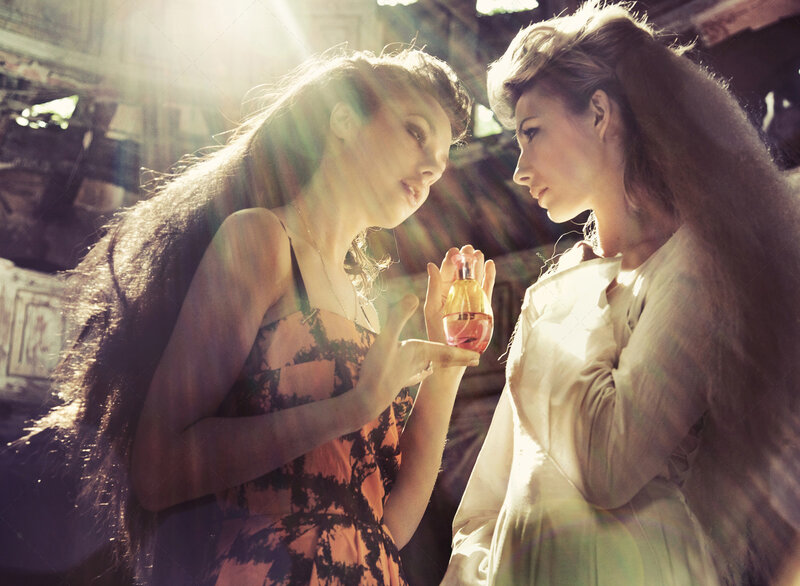 Two Women with Perfume Bottle
