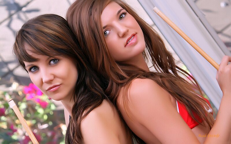 two women with pool cues