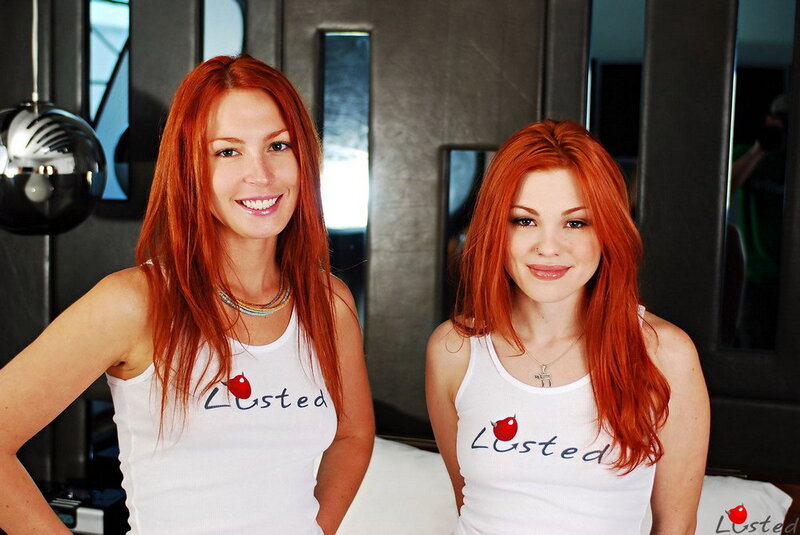 Two women with red hair smiling