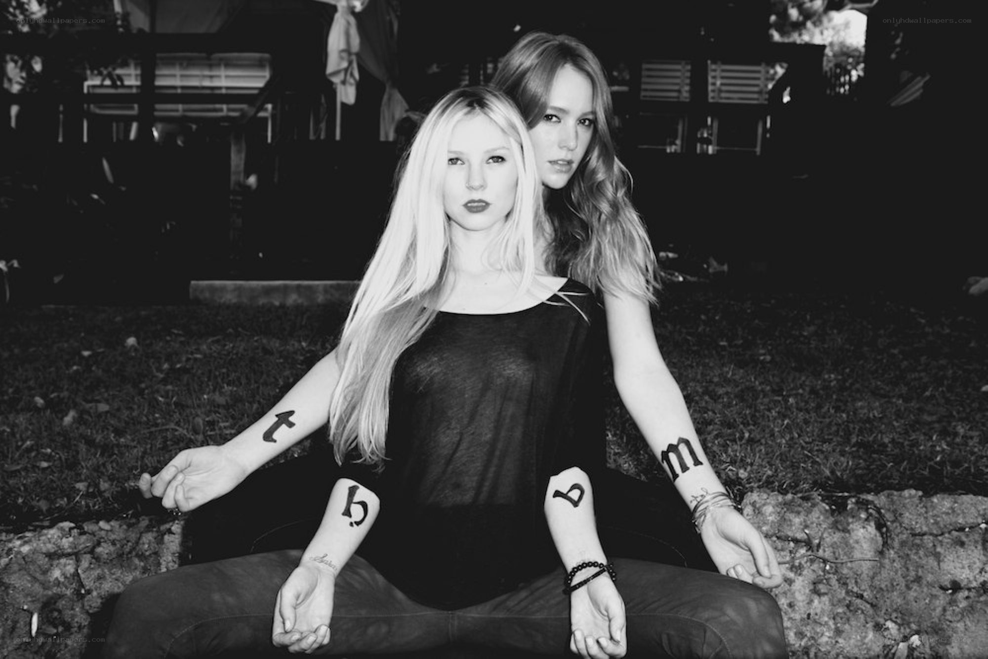two women with tattoos