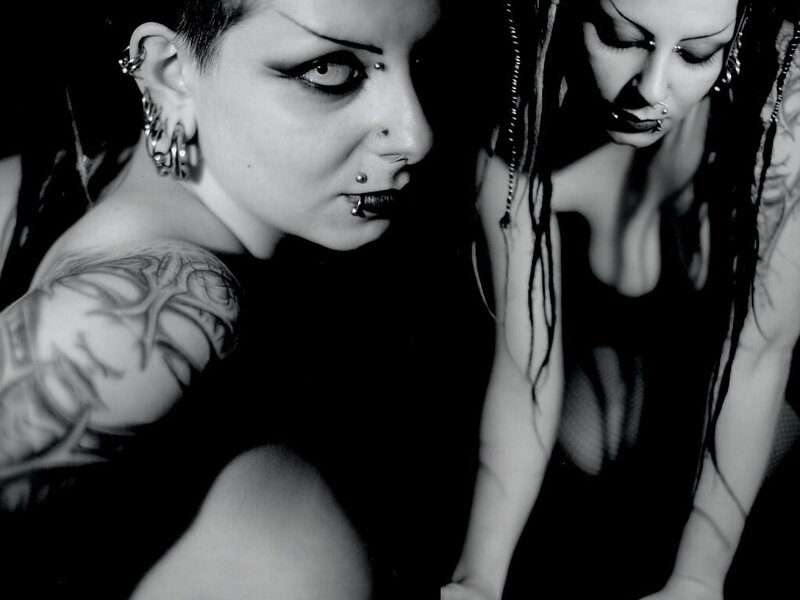two women with tattoos and piercings