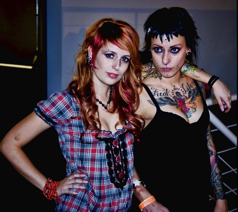 Two women with tattoos and piercings