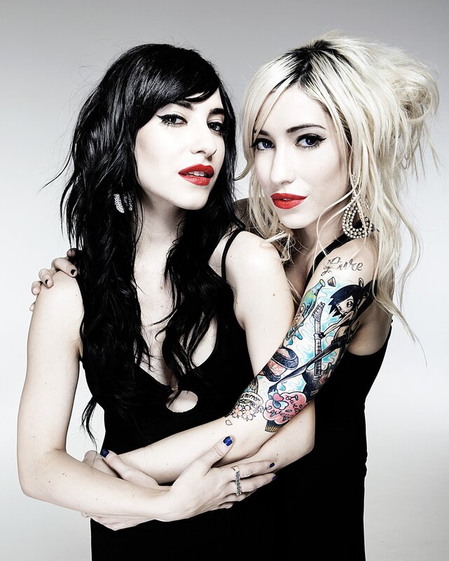 two women with tattoos and red lipstick