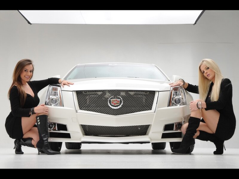 Two women with white Cadillac