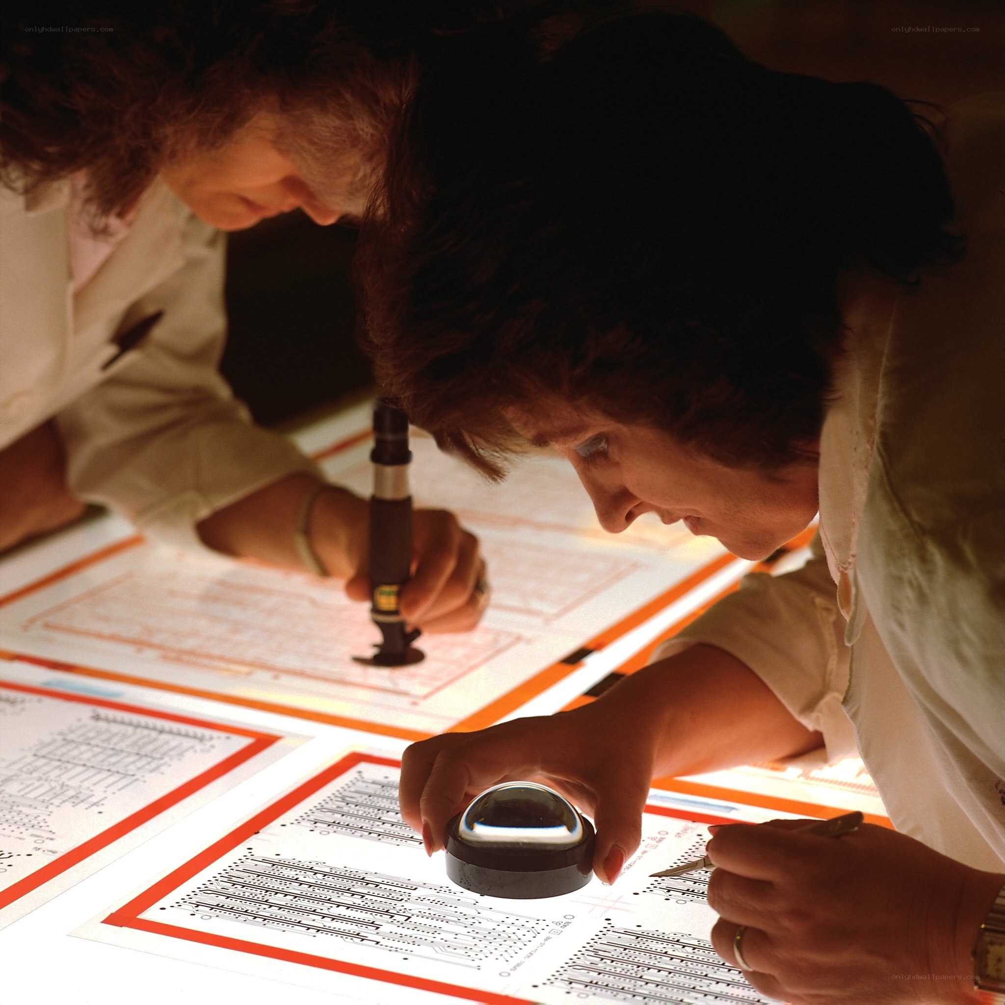 Two women working on circuit designs
