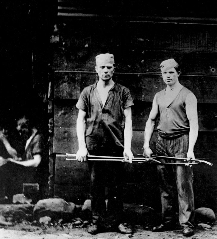 Two workers with tools
