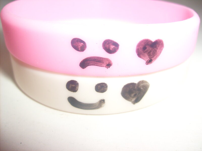 Two Wristbands with Faces — Pink