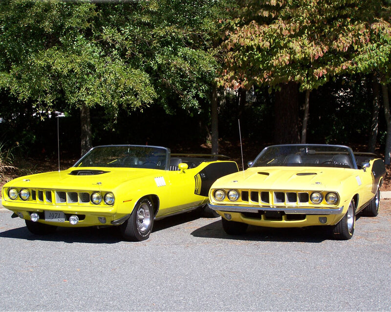 Two yellow classic convertibles
