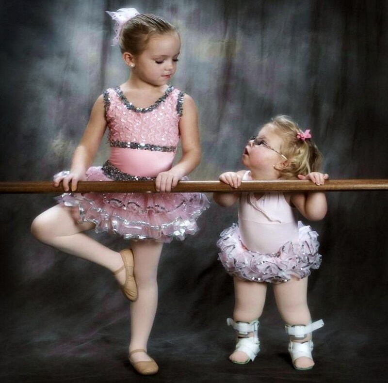 Two young ballerinas at barre