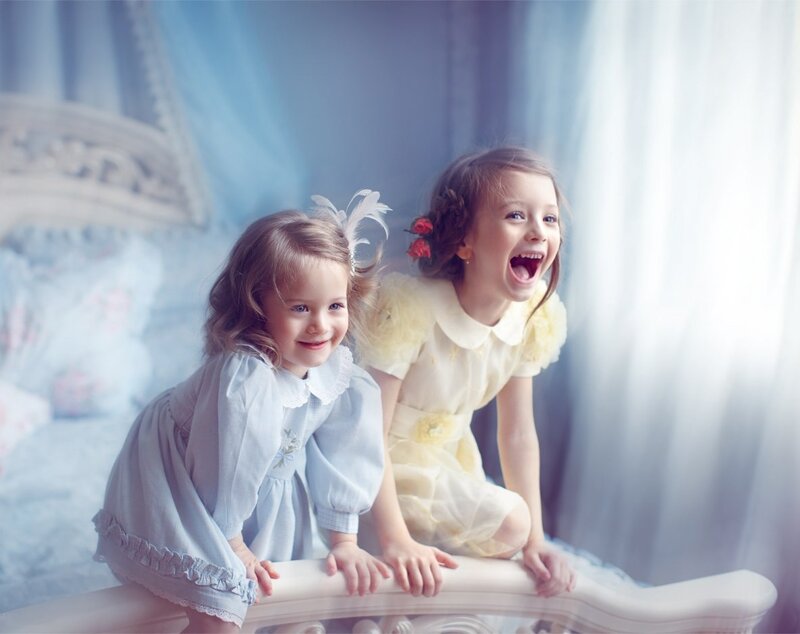 Two Young Girls on Bed