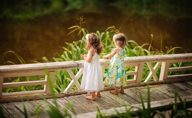 Two Young Girls on Bridge