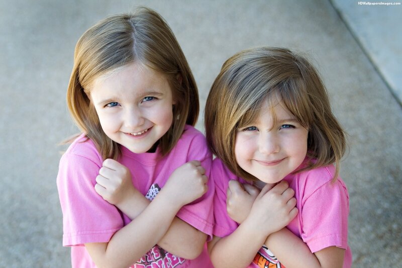 Two Young Girls Smiling — Pink