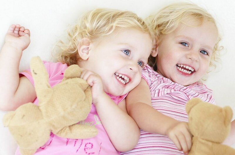 Two Young Girls with Teddy Bears