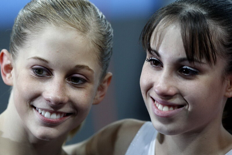 Two young gymnasts smiling