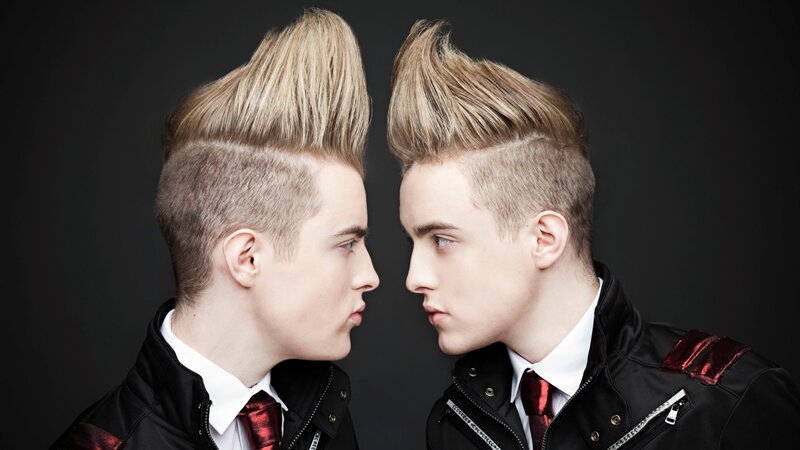 Two Young Men Facing Each Other