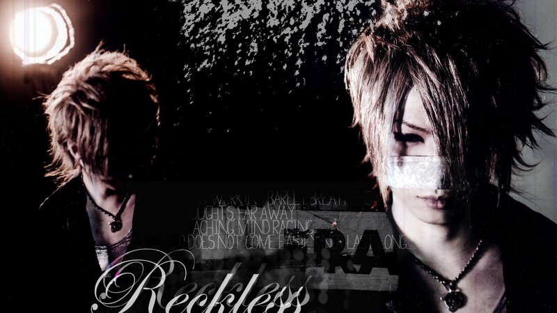Two Young Men in Dark Clothing