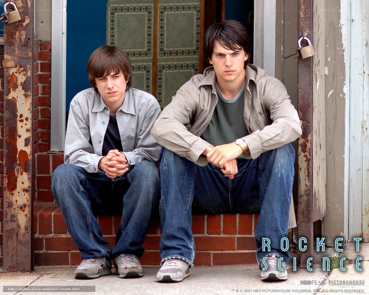 two young men sitting on steps