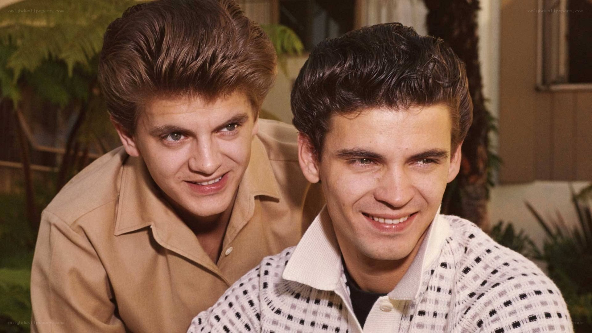 two young men smiling together