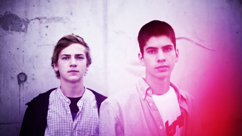 two young men standing together