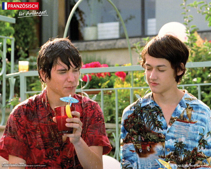 Two young men with drinks
