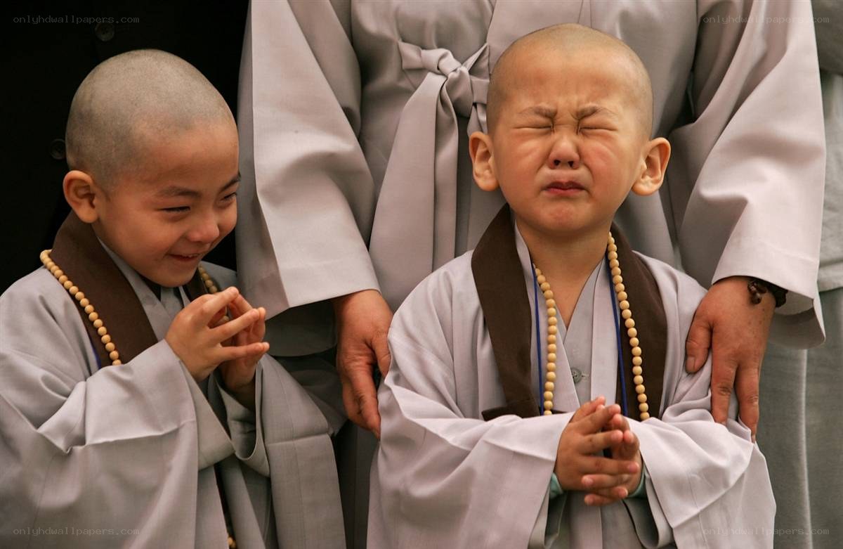 Two young monks in robes