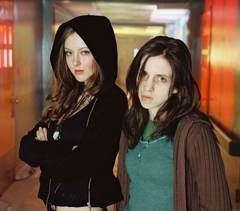 two young women in a hallway