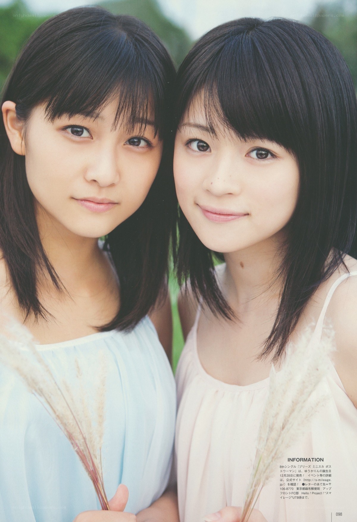 two young women with pampas grass