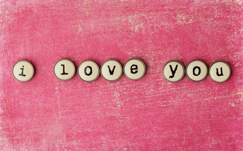 Typewriter Letters on Pink Surface