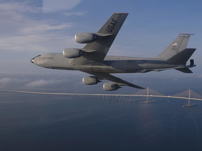 U.S. Air Force aircraft flying over bridge