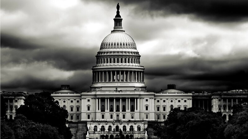U.S. Capitol under stormy sky