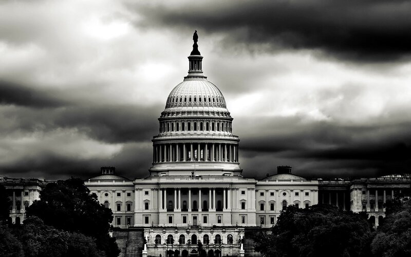 U.S. Capitol under stormy sky