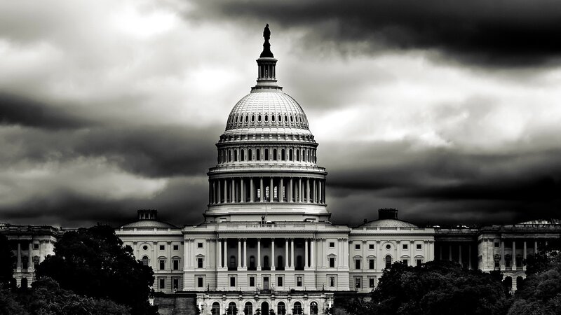 U.S. Capitol under stormy sky