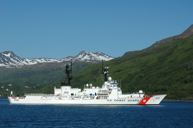 U.S. Coast Guard ship in mountainous bay
