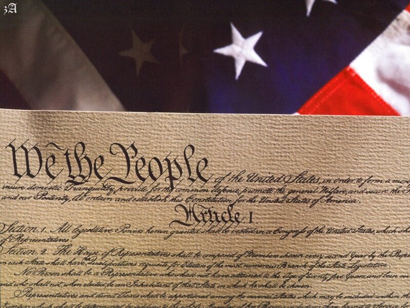 U.S. Constitution with American flag