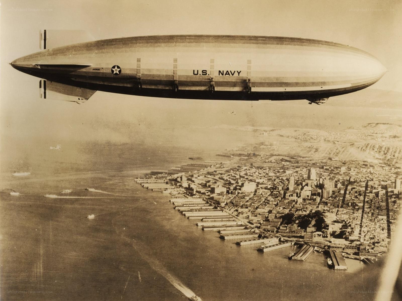 U.S. Navy blimp over city