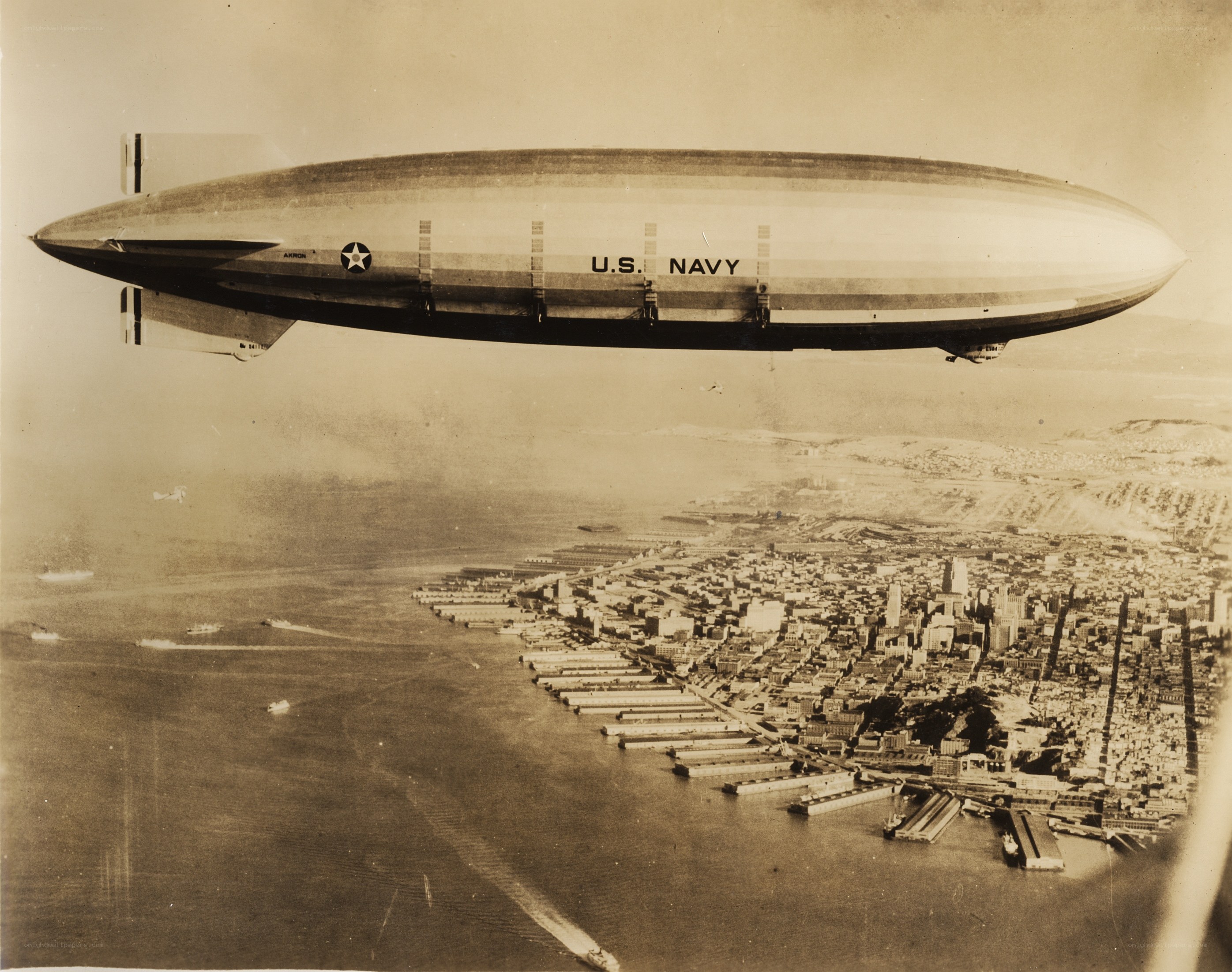 U.S. Navy blimp over city