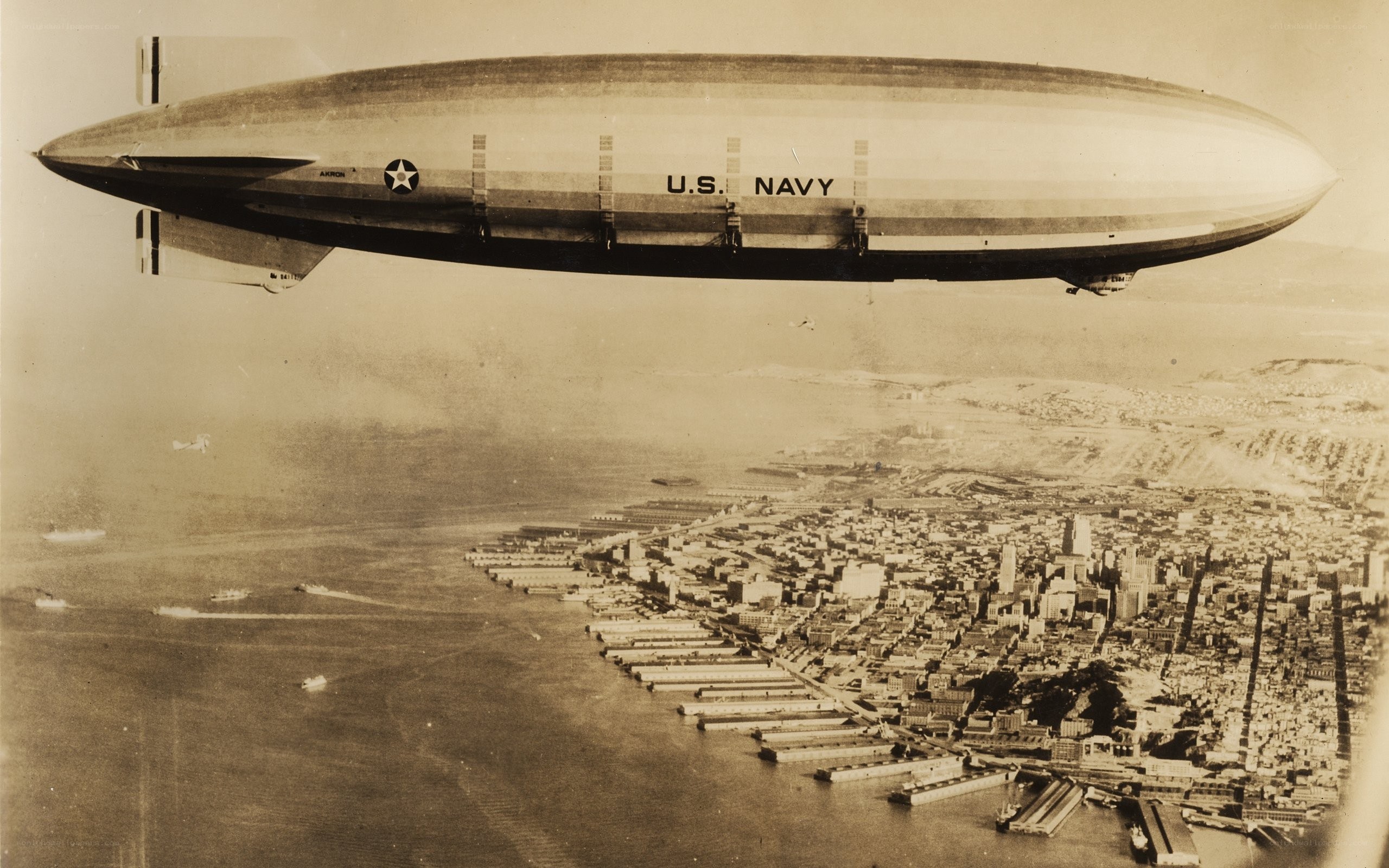 U.S. Navy blimp over city