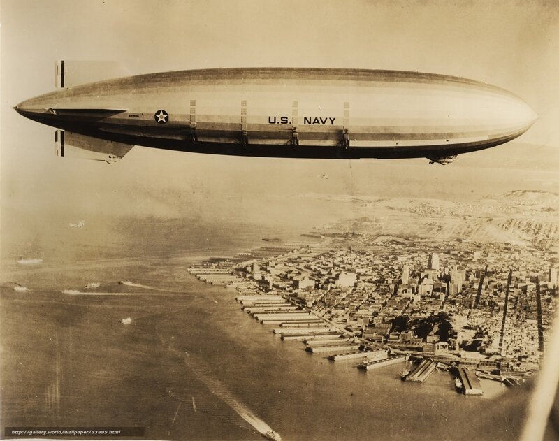 U.S. Navy blimp over city