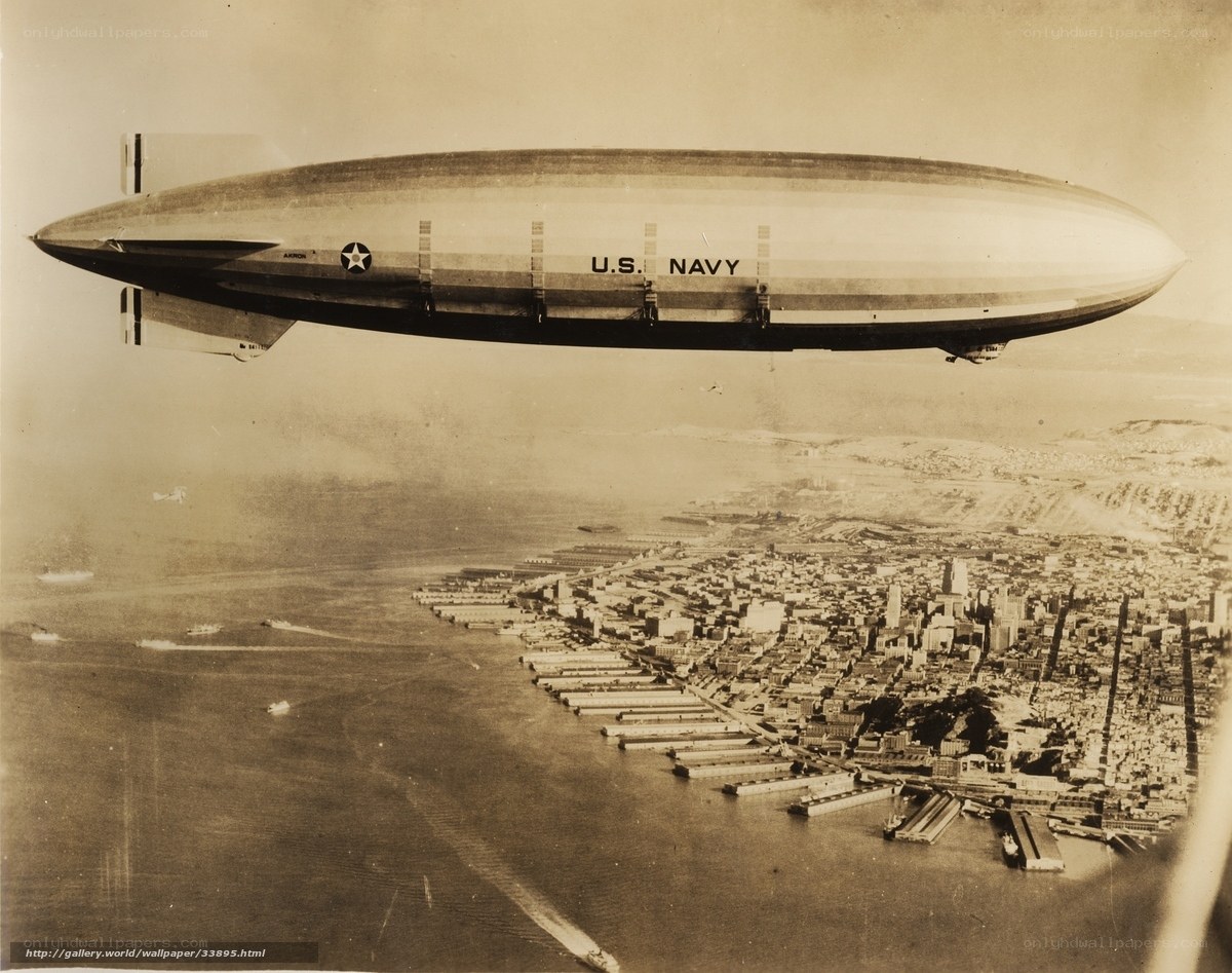 U.S. Navy blimp over city