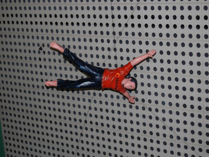 Ubuntu figurine on perforated wall