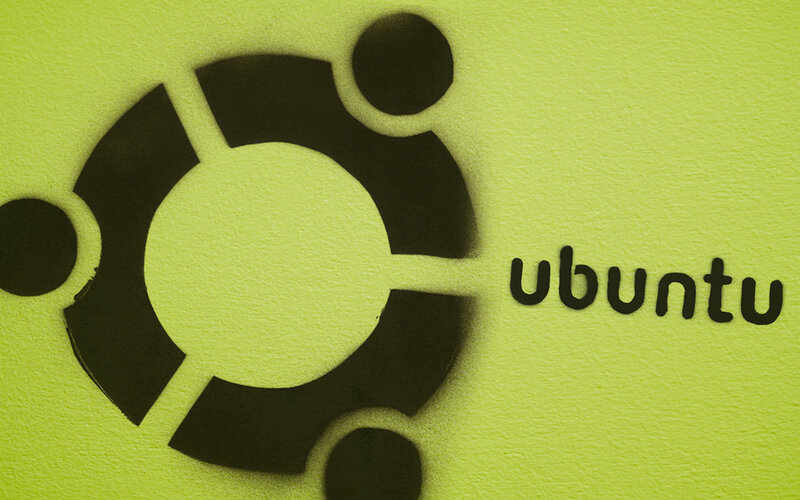 Ubuntu logo on green wall